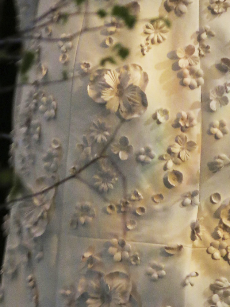 Leather flower detail on Nicholas Oakwell trench coat